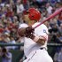 Texas Rangers' Nelson Cruz follows through on a grand slam off a pitch from Los Angeles Angels' Jered Weaver in the third inning of a baseball game, Sunday, May 13, 2012, in Arlington, Texas. The shot scored David Murphy, Adrian Beltre and Michael Young. (AP Photo/Tony Gutierrez)