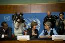 Kirsten Sandberg, center, chairperson of the U.N. human rights committee on the rights of the child, talks to committee members Maria Herczog, right, and Benyam Mezmur during a press conference at the United Nations headquarters in Geneva, Switzerland, Wednesday, Feb. 5, 2014. A U.N. human rights committee denounced the Vatican on Wednesday for adopting policies that allowed priests to rape and molest tens of thousands of children over decades, and urged it to open its files on the pedophiles and the churchmen who concealed their crimes. (AP Photo/Anja Niedringhaus)