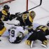 Bruins' Jagr and Seidenberg keep the puck away from Penguins' Dupuis and Bruins goalie Rask during the third period in Game 4 of their NHL Eastern Conference finals hockey playoff series in Boston
