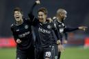 Hannover's scorer Hiroshi Kiyotake from Japan, center, Jimmy Briand from France, right, and Hiroki Sakai from Japan, left, celebrate their side's 2nd goal during the German Bundesliga soccer match between Hertha BSC Berlin and Hannover 96 at the Olympia stadium in Berlin, Germany, Friday, Nov. 7, 2014. (AP Photo/Michael Sohn)