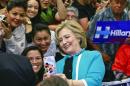 FILE - In this May 5, 2016 file photo, Democratic presidential candidate Hillary Clinton takes a photo with supporters at the end of a campaign stop at East Los Angeles College in Los Angeles. Bernie Sanders' campaign is mining deep into voter data from Hispanic enclaves, scouting for hidden supporters in an effort to undercut Hillary Clinton in a contest that he has vowed to fight to the end. Clinton ran up a 2-1 advantage with Hispanics in her 2008 win in California over Barack Obama and is making a strong push to do that again. (AP Photo/Damian Dovarganes)