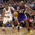 Los Angeles Lakers' Kobe Bryant drives past Los Angeles Clippers' Chris Paul during the second half of their NBA basketball game in Los Angeles
