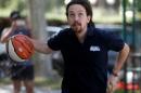 Podemos (We Can) leader Pablo Iglesias, plays ball on the eve of Spain's general election in Madrid