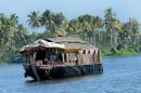 Tourists are seen enjoying a ride aboard a houseboat in the backwaters of Alappuzha, some 150 kms north of Thiruvananthapuram, capital of India's southern state of Kerala, on December 29, 2006