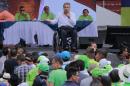 Ecuadorean Lenin Moreno (C) delivers a speech after he was annouced as presidential candidate for the Alianza Pais (Country Alliance) party next to Ecuadorean Presidnet Rafael Correa (L) in Quito on October 1, 2016