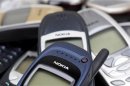 Illustration picture shows Nokia logo on used cell phones in Zurich