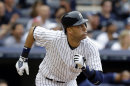 New York Yankees' Derek Jeter watches his first-inning solo home run against the Tampa Bay Rays in a baseball game on Sunday, July 28, 2013, in New York. (AP Photo/Kathy Willens)