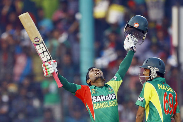 Bangladesh&#39;s Mushfiqur Rahim, left, celebrates after scoring a century, as Nasir Hossain smiles during the Asia Cup one-day international cricket tournament against India in Fatullah, near Dhaka, 