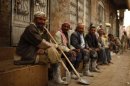 Labourers wait to be hired on a street in Sanaa June 5, 2012