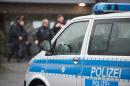 German police searched the homes of two men suspected of having ties to "a terrorist group" in Syria