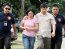 Senate security personnel bring Annaliza and Reynold Marzan to the Quezon City Jail’s female dormitory at Camp Karingal yesterday.<strong> BOY SANTOS</strong>