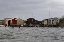 Fishing huts destroyed by Hurricane Sandy are seen on an island near Fire Island, New York