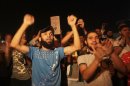 Syrian refugees and local residents protest against Syrian President Assad in front of the Syrian Embassy in Amman, after performing night prayers during the holy month of Ramadan