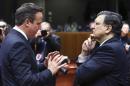 Britain's PM Cameron talks to EU Commission President Barroso during a EU leaders summit in Brussels