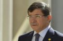 Turkish Foreign Minister Ahmet Davutoglu arrives to attend a Friends of Syria meeting at The Foreign Office in London