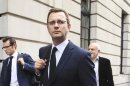 Andy Coulson, former editor of the News of the World and Former spokesman for Britian's Prime Minister David Cameron, leaves after giving evidence before the Leveson Inquiry at the High Court in central London