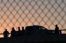 US Border Patrol officers keep watch along the border fence separating the US and Mexico in the town of El Paso, Texas on February 17, 2016