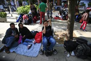 Migrants pass time in Victoria square in Athens, Tuesday,&nbsp;&hellip;