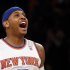 New York Knicks forward Carmelo Anthony reacts after hitting a three-point shot against the Boston Celtics in the first quarter of Game 1 of their NBA Eastern Conference Quarterfinals basketball playoff series in New York