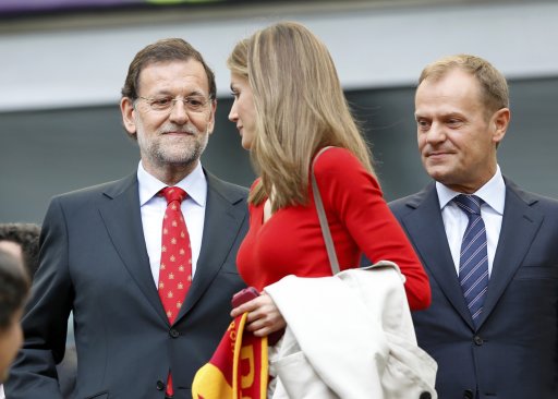 Spain's Prime Minister Rajoy looks at Spain's Princess Letizia as they wait for the start of their Group C Euro 2012 soccer match between Spain and Italy in Gdansk