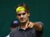 Federer of Switzerland reacts during his match against Raonic of Canada at the Halle Open ATP tennis tournament in Halle
