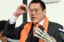 Former Japanese professional wrestler and a Japanese parliament member Antonio Inoki -- real name Kanji Inoki -- speaks to reporters as he returns from North Korea at the Tokyo international airport on January 16, 2014