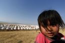 A child is seen at a camp for displaced people, in Shikhan, in Kurdistan's Dohuk province, on June 24, 2014