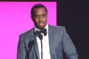 FILE - In this Nov. 22, 2015, file photo, Sean "Diddy" Combs presents the award for best collaboration of the year at the American Music Awards in Los Angeles. Combs, the founder of Capital Preparatory Harlem Charter School, announced Monday, March 28, 2016, that the school will open in the fall of 2016. (Photo by Matt Sayles/Invision/AP, File)