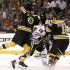 Bruins Thornton and Daugavins collide with Blackhawks Sharp during Game 3 of their NHL Stanley Cup Finals in Boston