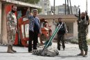 Syrian fighters test out a new rocket in Aleppo on April 1. 