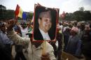 File picture shows a supporter of the Rastriya Prajatantra Party Nepal holds a portrait of former King Gyanendra Shah during a protest rally in Kathmandu