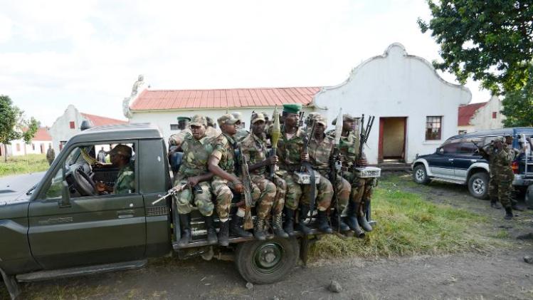 M23 rebels sit on the back of a truck on June 1, 2013 in Rumangabo military camp, 40 km from Goma