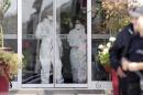 Medical personnel leave a quarantined hotel in Skopje