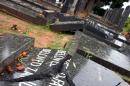 A damaged tombstone on January 10, 2005, at a cemetery west of Johannesburg