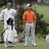Amateur Guan Tianlang, of China, discusses his shot with caddie Brian Tam on the first fairway during the second round of the Masters golf tournament Friday, April 12, 2013, in Augusta, Ga. (AP Photo/Darron Cummings)