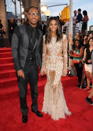 File-This Aug. 25, 2013 file photo shows The Future, left, and Ciara arriving at the MTV Video Music Awards at the Barclays Center in the Brooklyn borough of New York. Ciara's future is Future: The R&B singer and the rapper-producer are engaged. Future surprised the Grammy-winner with a 15-carat diamond ring over the weekend, their publicist, Chris Chambers, told The Associated Press on Sunday Oct. 27, 2013. She was already celebrating her 28th birthday in New York when he proposed. (Photo by Scott Gries/Invision/AP, File)