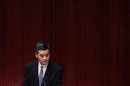 Hong Kong Chief Executive Leung listens to a question from a lawmaker in Hong Kong