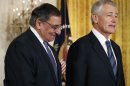 Current U.S. Secretary of Defense Panetta and U.S. President Obama's nominee for Secretary of Defense, former Senator Hagel, stand next to each other at the White House in Washington