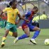 Cape Verde's Carlitos fends off South Africa's Tshabalala during opening match of AFCON 2013 soccer tournament in Soweto