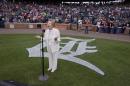 Hermina Hirsch, 89, a Holocaust survivor, sings the national anthem before the baseball game between the Detroit Tigers and the Tampa Bay Rays, Saturday, May 21, 2016, in Detroit. Hirsch's bucket list included singing the anthem before a Tigers game. (AP Photo/Carlos Osorio)