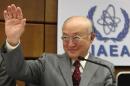 IAEA Director General Amano waves as he arrives for a board of governors meeting at the IAEA headquarters in Vienna