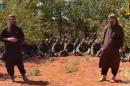 Still image of members of the Nusra Front speaking in front of U.N. peacekeepers in an unknown location