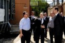 In this photo released by the Syrian official news agency SANA, President Bashar Assad, right, visits the Umayyad Electrical Station on May Day, a day after a powerful bomb hit the capital. in Damascus, Syria, Wednesday, May 1, 2013. (AP Photo/SANA)