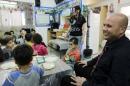 Itamar Shimoni, Israeli mayor of the costal city of Ashkelon, visits a kindergarten in Ashkelen, Israel, Thursday, Nov. 20, 2014. Shimoni has suspended Israeli Arab laborers from work, renovating bomb shelters at local day-care centers. The move drew widespread criticism on Thursday, including from Netanyahu who said "there is no place for discrimination against Israeli Arabs." (AP Photo/Tsafrir Abayov)