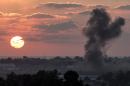 A picture taken from the Israeli Gaza border shows smoke billowing from the Gaza Strip following an Israeli air strike on July 16, 2014