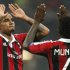 AC Milan's Muntari and Boateng react at the end of his Champions League soccer match against Barcelona at the San Siro stadium in Milan