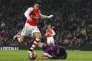 Arsenal's Chilean striker Alexis Sanchez (L) goes around Hull City's English goalkeeper Steve Harper (R) but fails to score during the English FA Cup third round football match at the Emirates Stadium in London on January 4, 2015