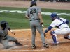 Vanderbilt's Anthony Gomez, left, steals home in the ninth inning of their 8-6 win over Florida in an NCAA college baseball game during the Southeastern Conference tournament in Hoover, Ala., Saturday, May 26, 2012. At right is Florida catcher Mike Zunino.  (AP Photo/Dave Martin)