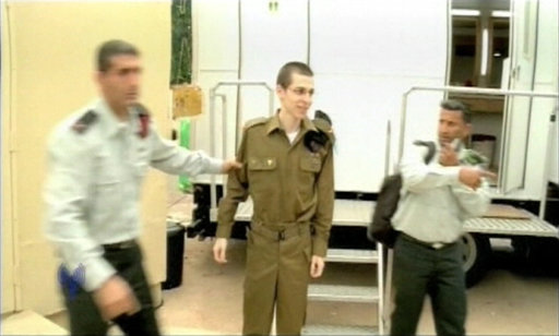 Frame grab shows Israeli soldier Gilad Shalit walking at Kerem Shalom crossing outside the southern Gaza Strip