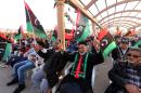 Libyans take part in celebrations marking the fifth anniversary of the Libyan revolution which toppled strongman Moamer Kadhafi, at Martyrs' Square in the capital Tripoli, on February 15, 2016